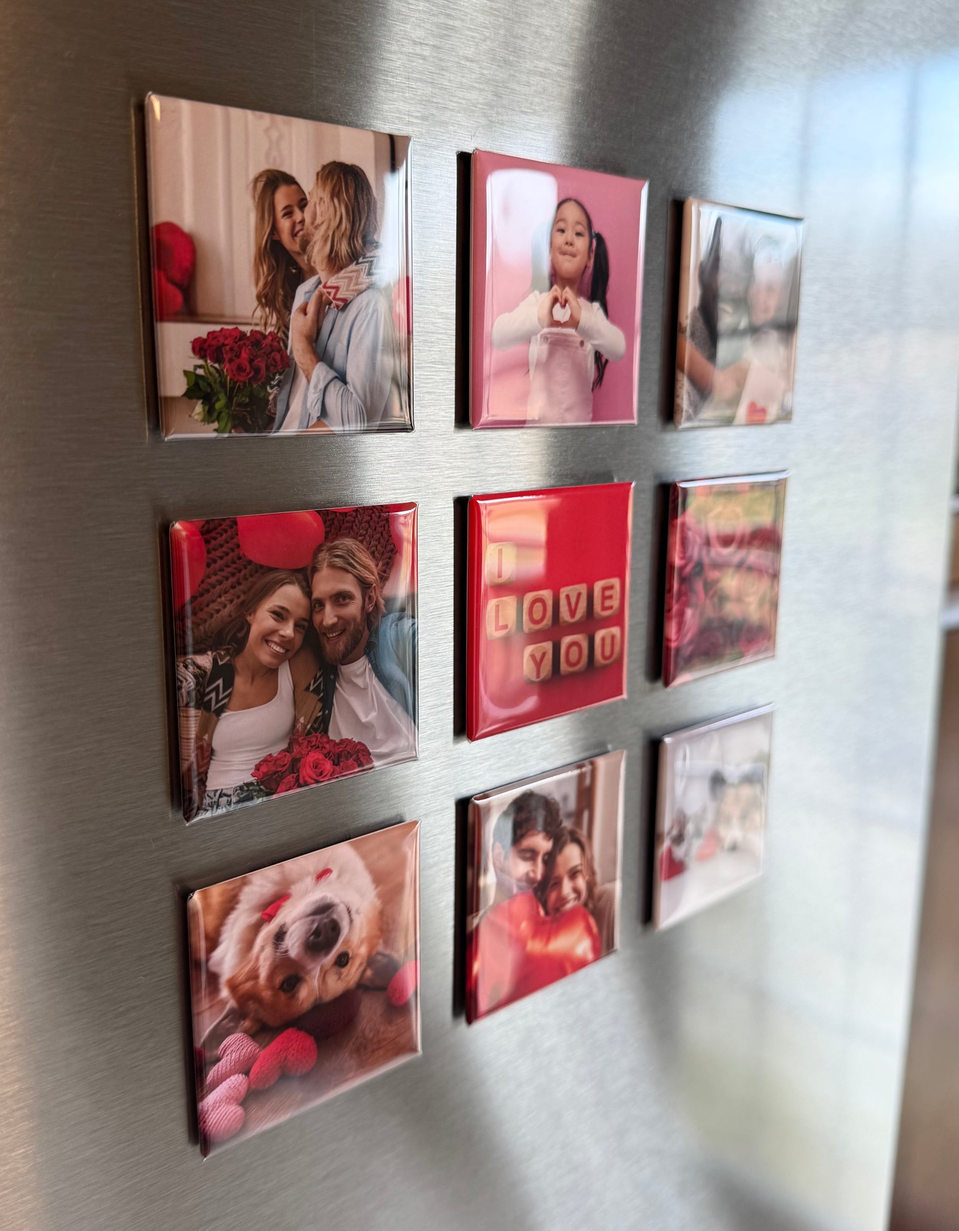 Collection of colorful photo magnets on a refrigerator door. Picture shows their glossy appearance. 